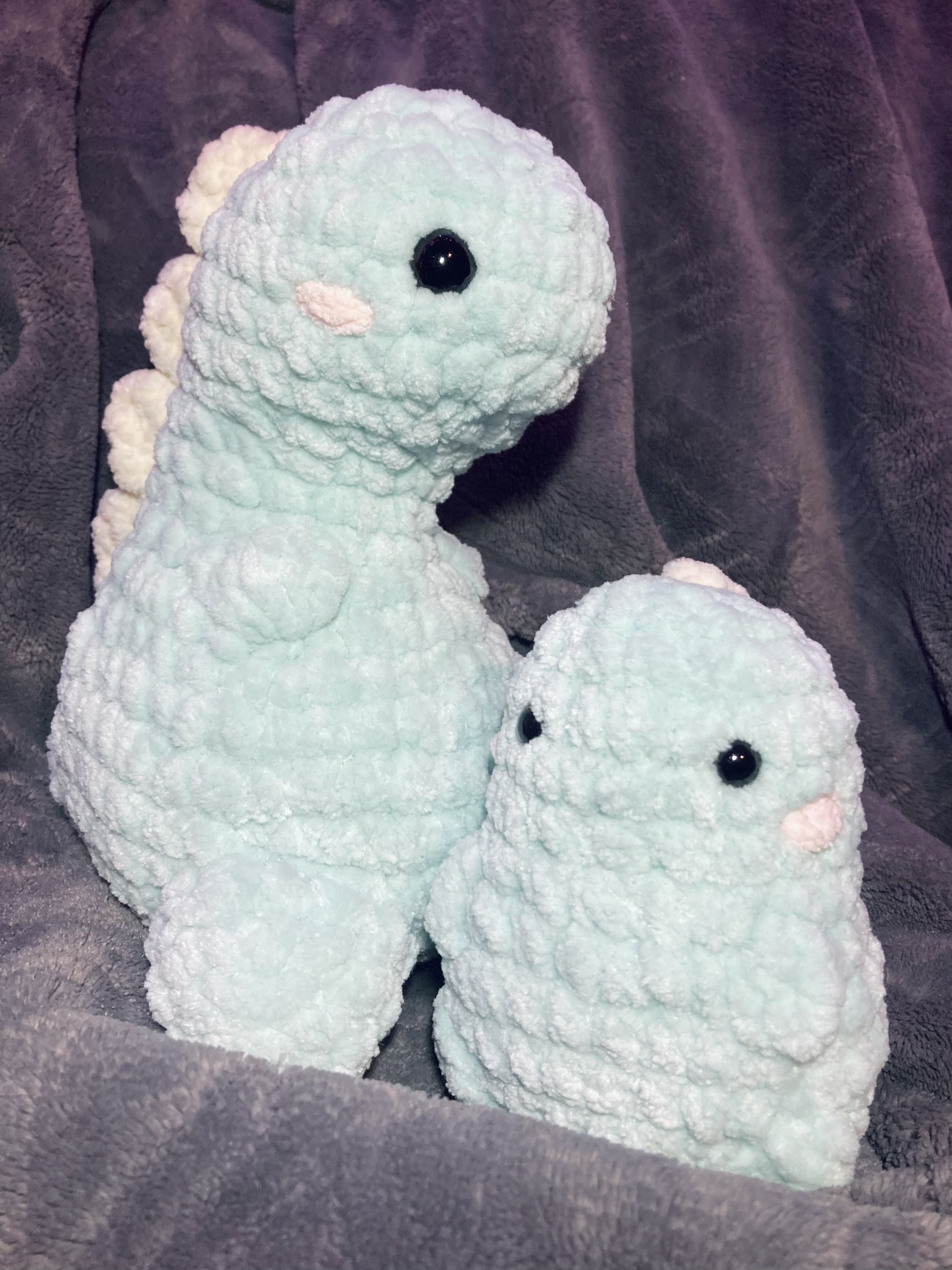 set of matching big and baby dinosaurs in pastel colors for a friend's birthday